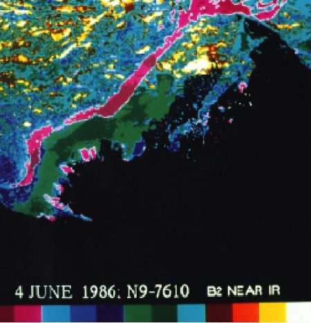 Advanced Very High Resolution Radiometer (AVHRR) satellite image (June 4, 1986) showing a color composite of the visible data band for the Mackenzie Delta River water overflowing the landfast ice can be seen as purple regions (map/graphic/illustration)