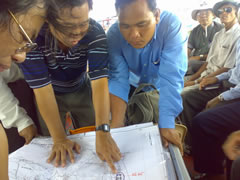 Staff of the Kampot and Phu Quoc Sites working together at sea with fishermen
